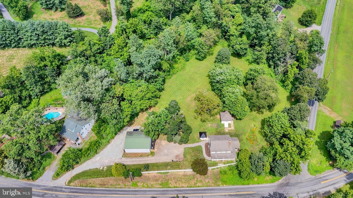 1069 Rawlinsville Road Willow Street, PA 17584 - Photo 46 of 47 an aerial view of a house with a yard and large trees