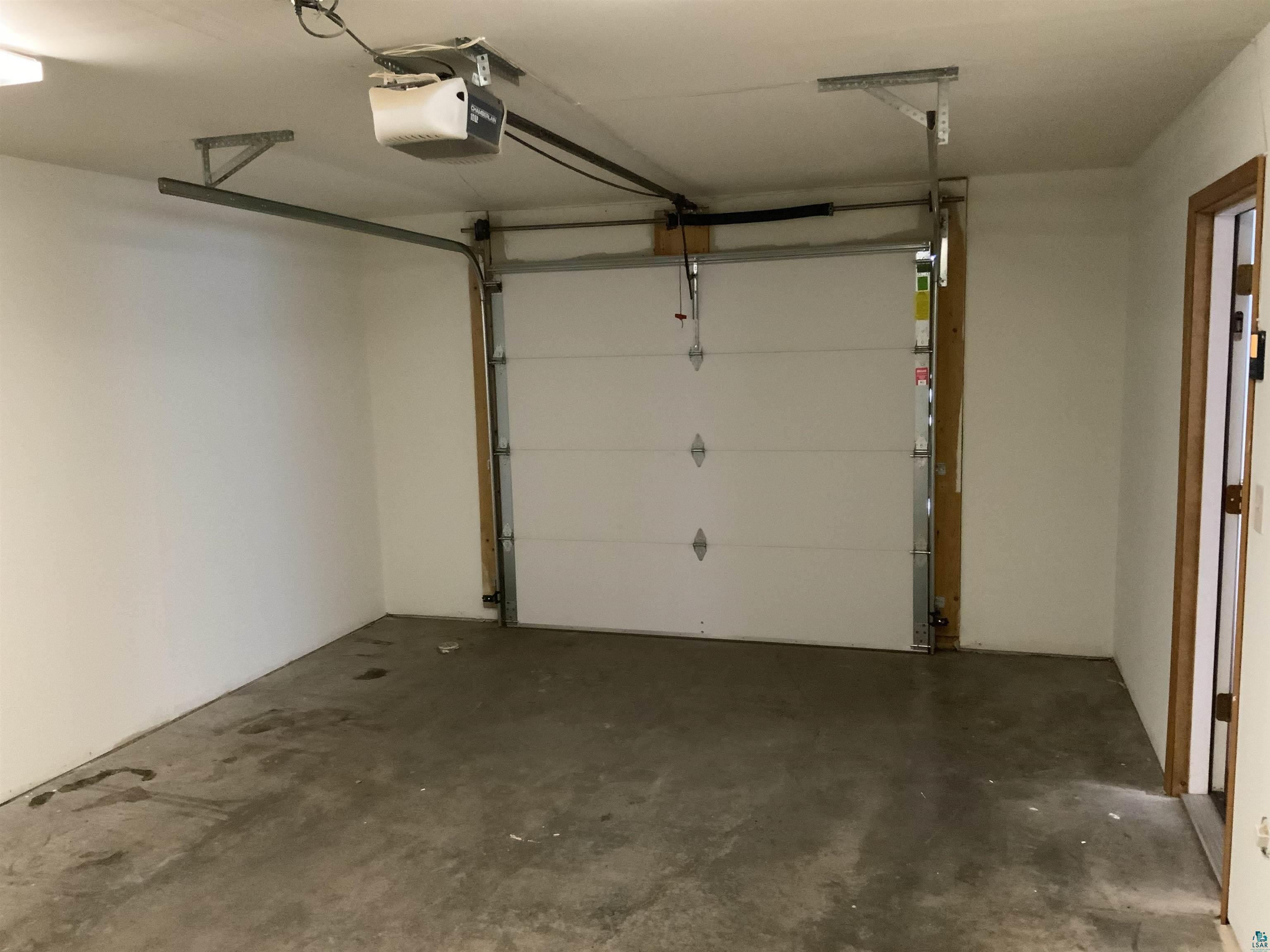 904 Spring Lake Road Cloquet, MN 55720 - Photo 13 of 14 Garage with a garage door opener