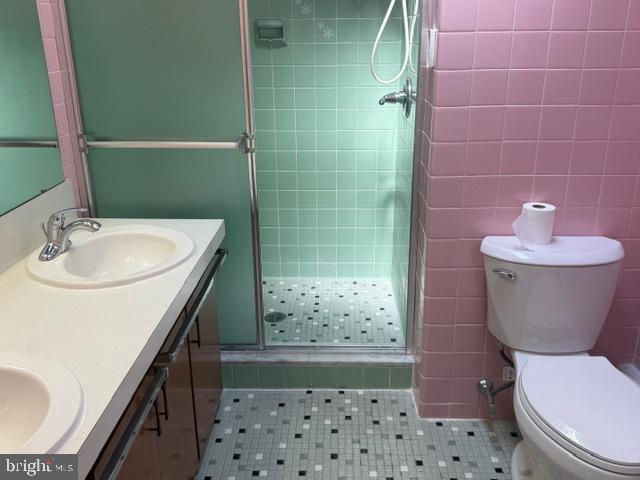 6315 Mershon Street Philadelphia, PA 19149 - Photo 12 of 19 a bathroom with a sink a toilet and shower