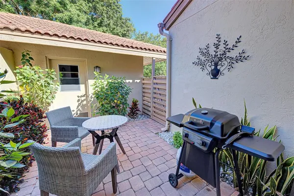 a view of a chairs and table in the patio