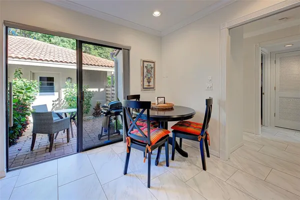 a view of a dining room with furniture and a window