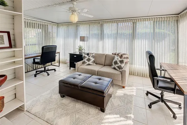 a living room with furniture and a window