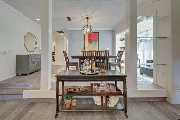 a view of a room with furniture and wooden floor