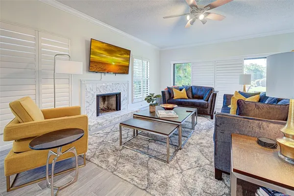 a living room with furniture and a fireplace
