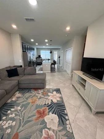 a living room with a couch and a flat screen tv