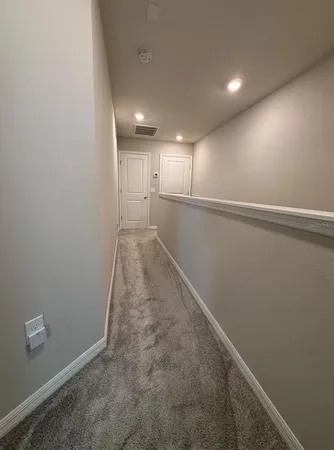 a bedroom with a bed and a mirror