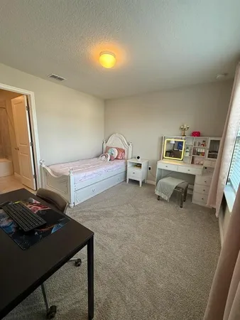 a living room with furniture and window