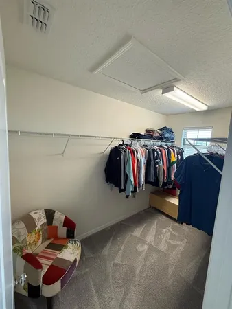 a view of a lake with a table and chairs
