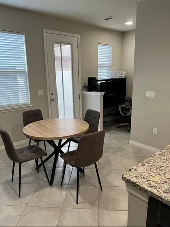 a view of a dining room with furniture