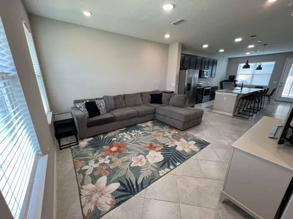 a living room with furniture and a couch