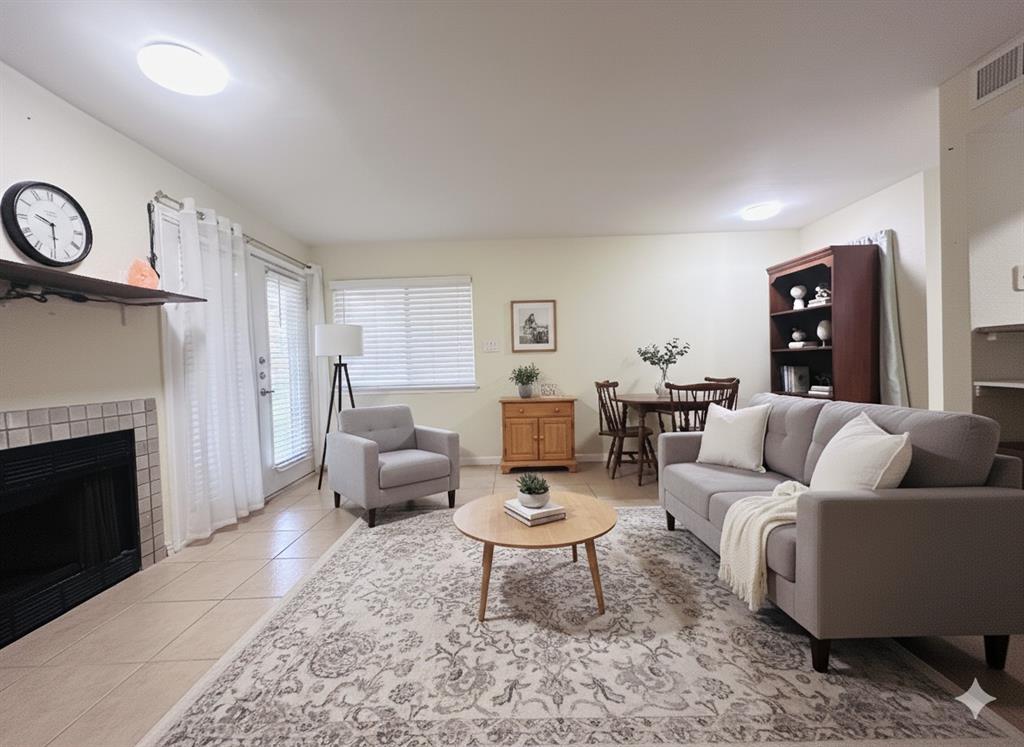 9827 Walnut Street, Unit 113 Dallas, TX 75243 - Photo 1 of 1 a living room with furniture and a fireplace