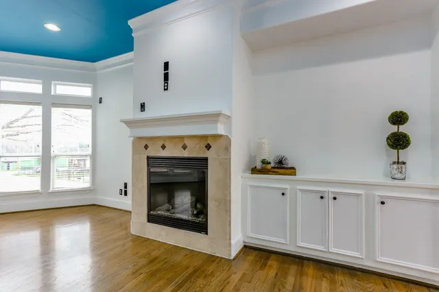 a hallway with fireplace and wooden floor