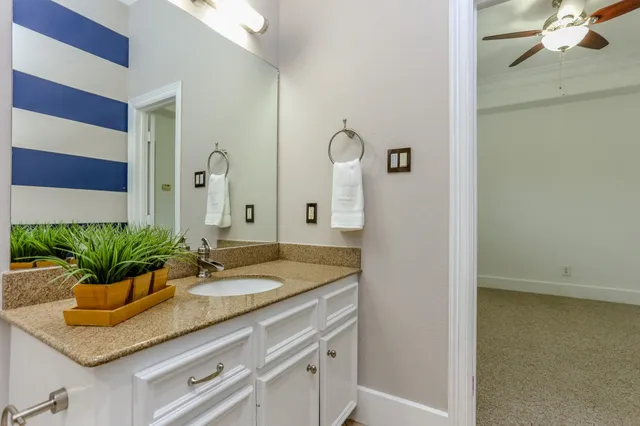 a bathroom with sink and mirror