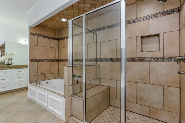 a bathroom with a bathtub and shower