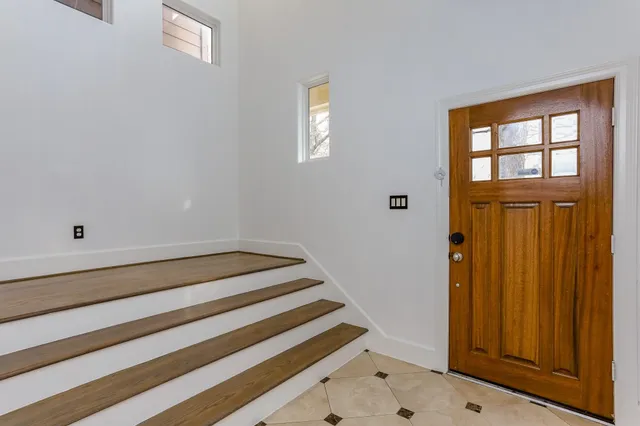 a view of room with window and hallway