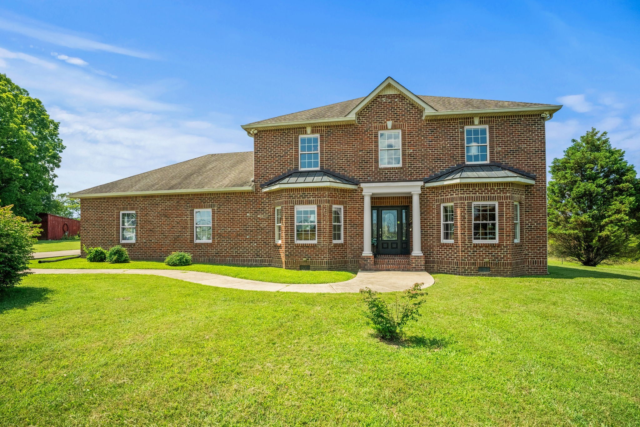 4313 South Garrett Road Springfield, TN 37172 - Photo 2 of 69 a front view of a house with a yard and garage