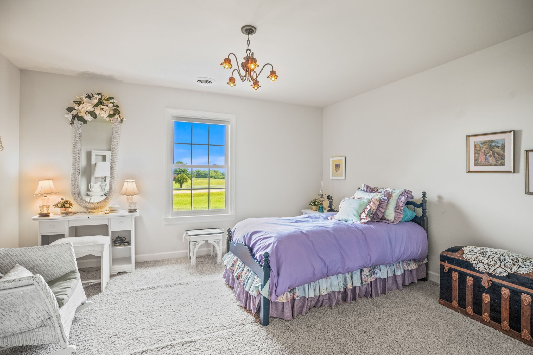 4313 South Garrett Road Springfield, TN 37172 - Photo 35 of 69 a bedroom with a bed and a chandelier