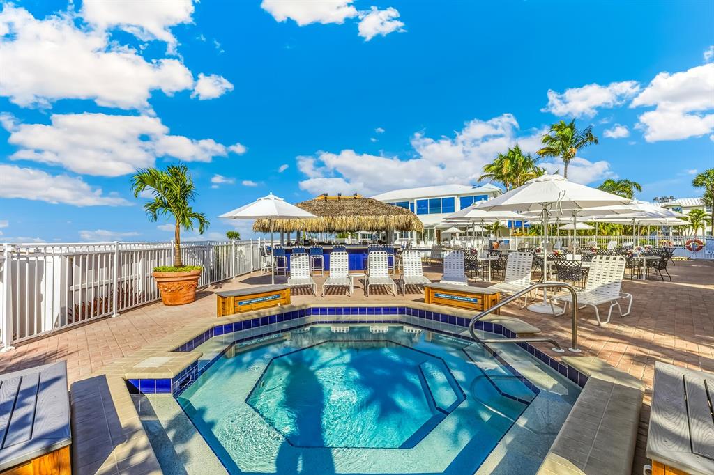 5850 Gasparilla Road, Unit M4 Boca Grande, FL 33921 - Photo 28 of 36 a view of a swimming pool with a patio