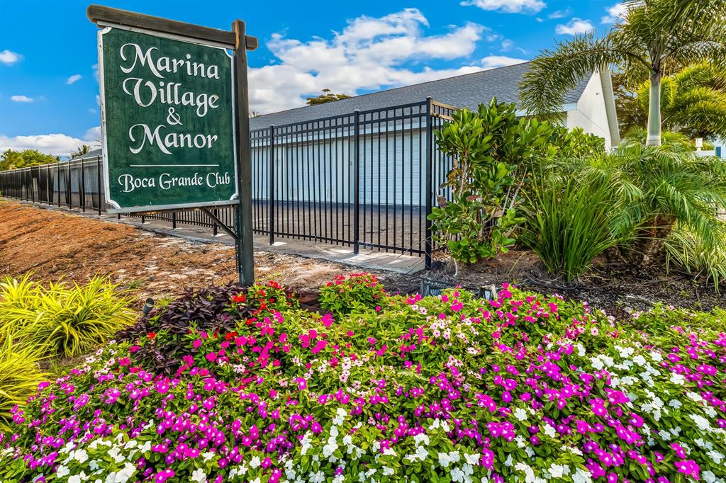 5850 Gasparilla Road, Unit M4 Boca Grande, FL 33921 - Photo 3 of 36 a sign that is in front of flowers