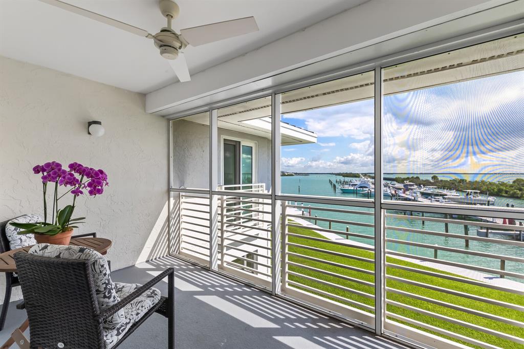 5850 Gasparilla Road, Unit M4 Boca Grande, FL 33921 - Photo 5 of 36 a view of a two chairs in the balcony