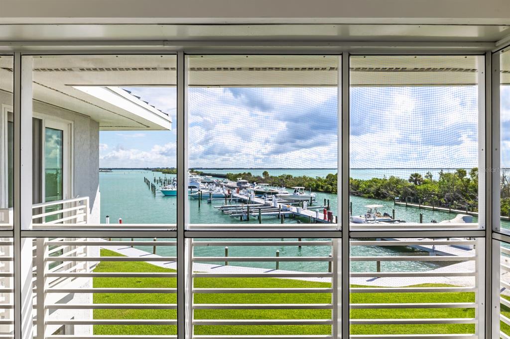 5850 Gasparilla Road, Unit M4 Boca Grande, FL 33921 - Photo 6 of 36 a view of a glass door with a glass door