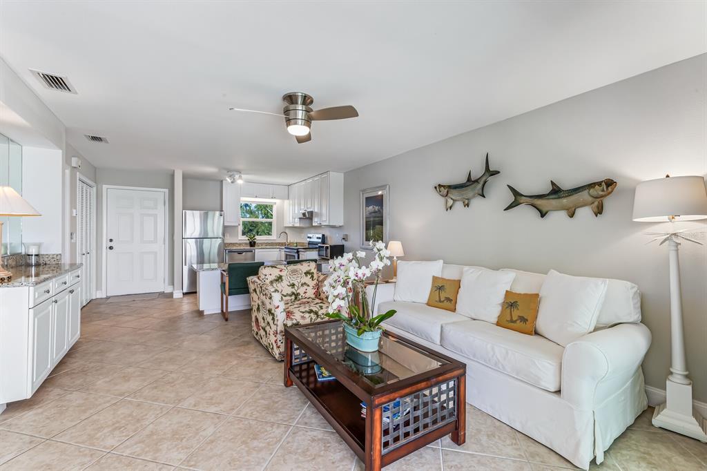 5850 Gasparilla Road, Unit M4 Boca Grande, FL 33921 - Photo 9 of 36 a living room with furniture and wooden floor
