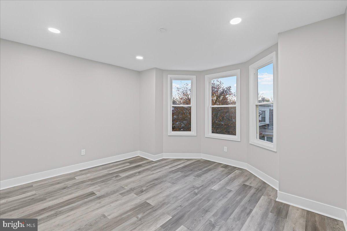 6629 Ross Street Philadelphia, PA 19119 - Photo 11 of 26 a view of empty room with wooden floor and fan
