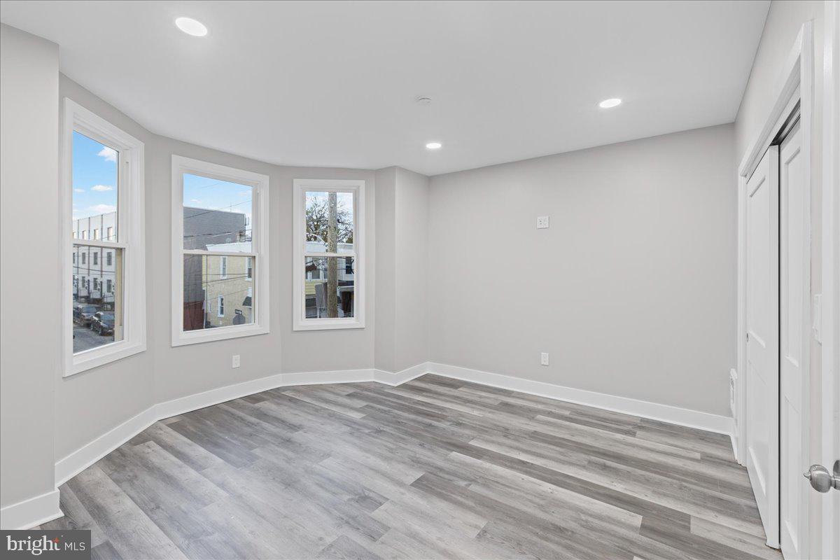 6629 Ross Street Philadelphia, PA 19119 - Photo 12 of 26 a view of empty room with wooden floor and fan