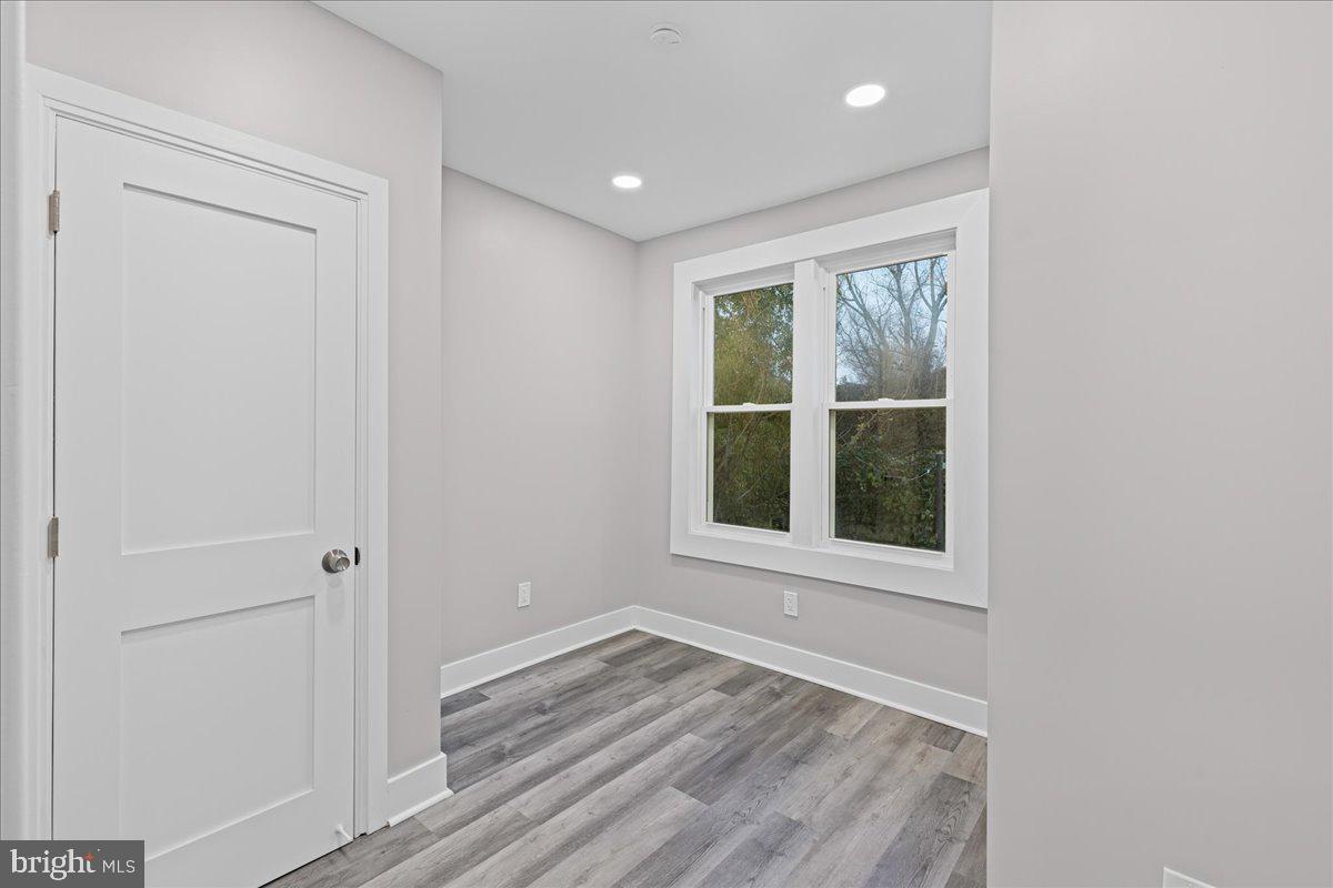6629 Ross Street Philadelphia, PA 19119 - Photo 18 of 26 an empty room with wooden floor and windows