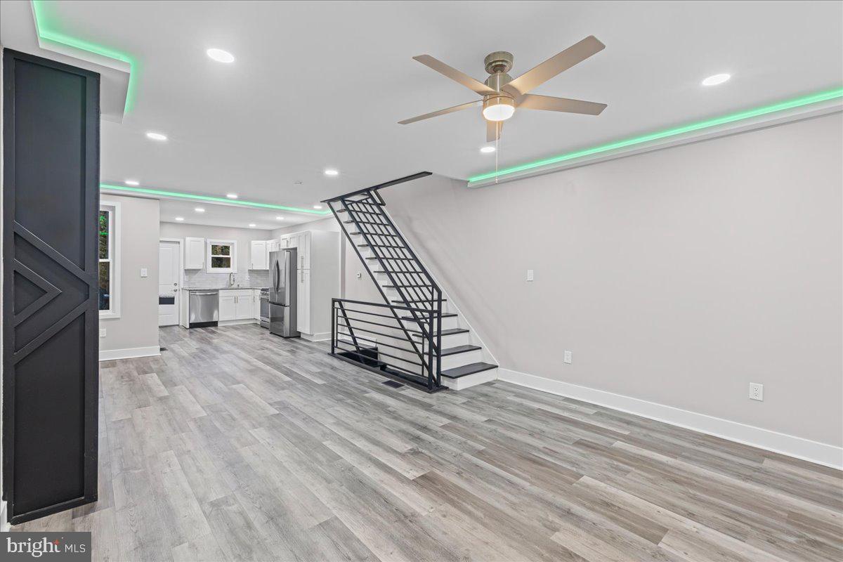 6629 Ross Street Philadelphia, PA 19119 - Photo 2 of 26 an entryway in a hall with a window and a ceiling fan