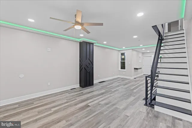 an empty room with windows and closet