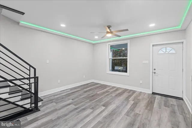 a view of an empty room with stairs and stairs