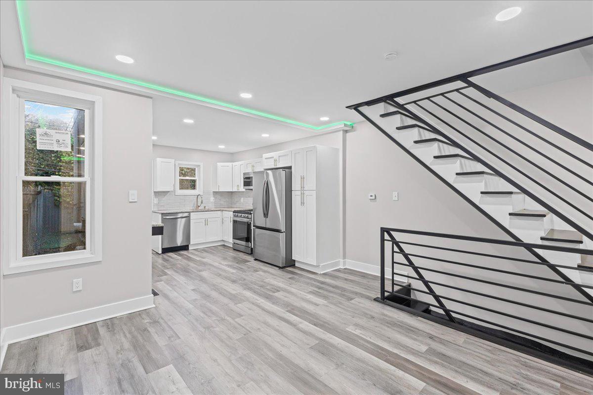 6629 Ross Street Philadelphia, PA 19119 - Photo 8 of 26 a view of a hallway with wooden floor and staircase