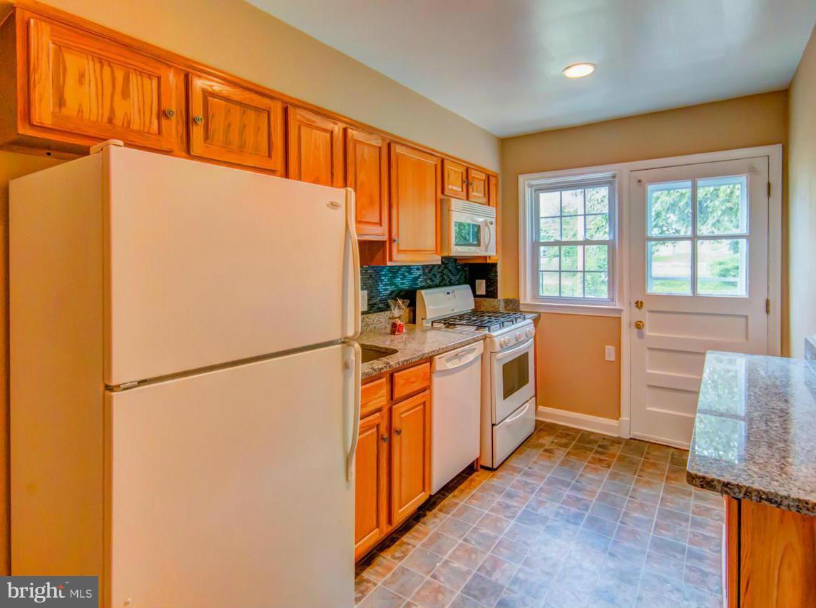 1546 Northbourne Road Baltimore, MD 21239 - Photo 1 of 18 a kitchen with stainless steel appliances a refrigerator a stove a sink and a more cabinets