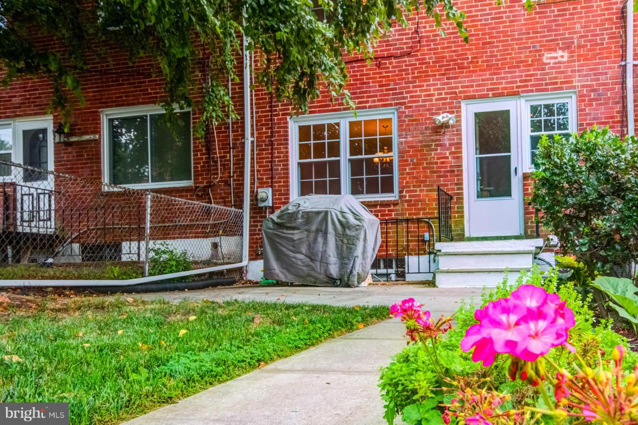 1546 Northbourne Road Baltimore, MD 21239 - Photo 18 of 18 a front view of a house with garden