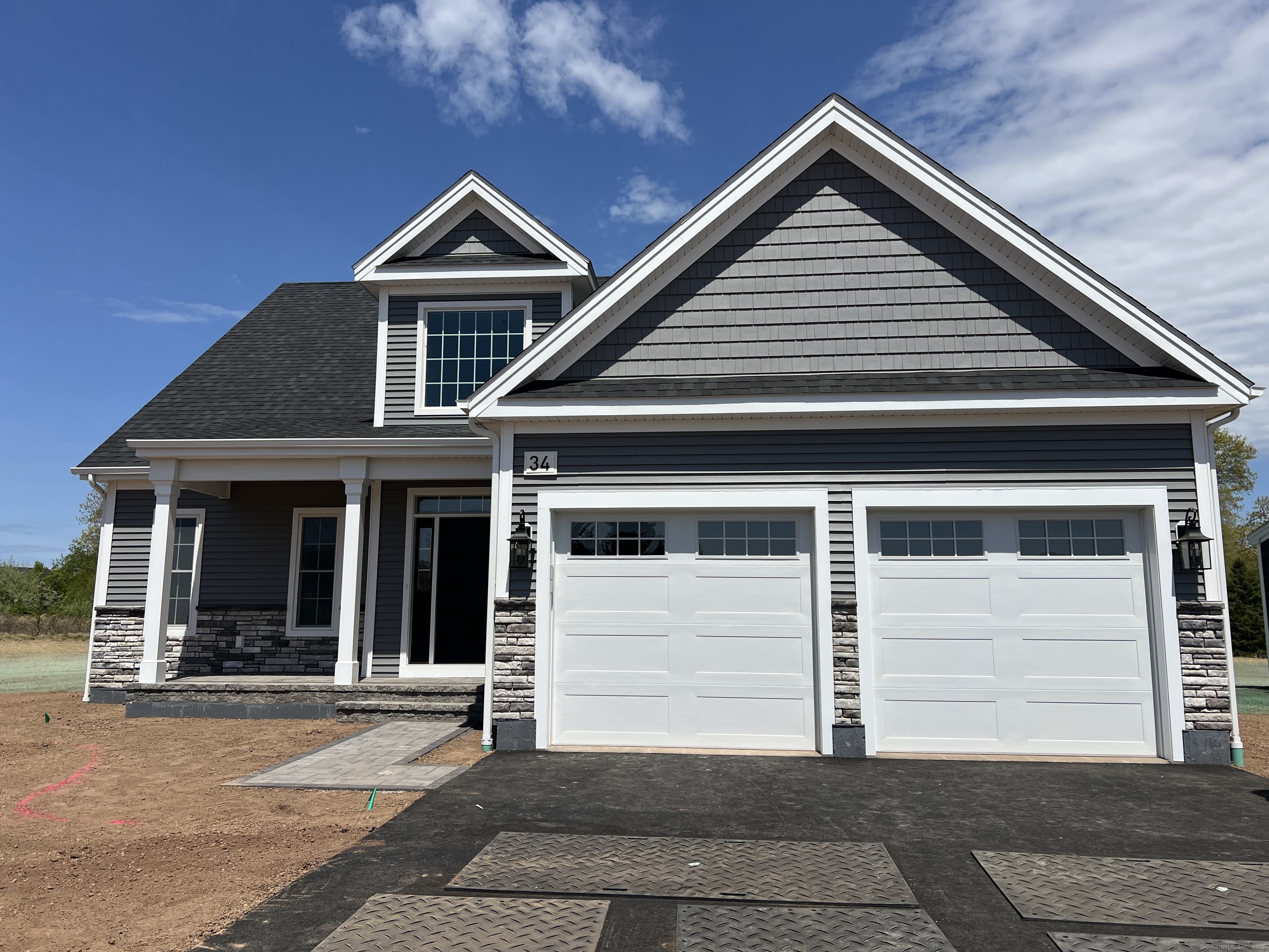 a front view of a house with a garage