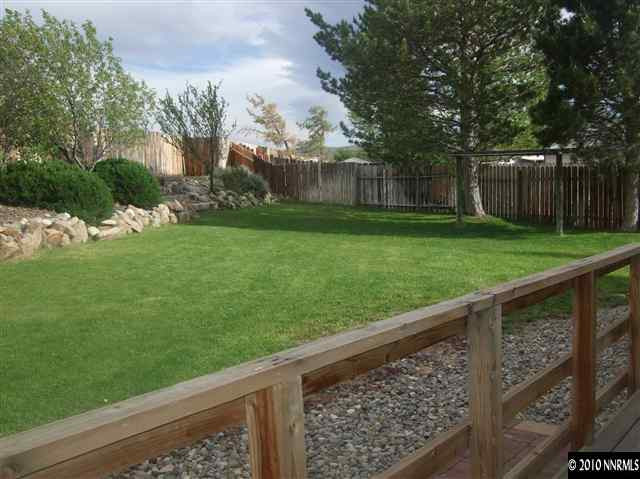 10012 Albite Street Reno, NV 89506 - Photo 8 of 9 a view of a wooden deck and a backyard