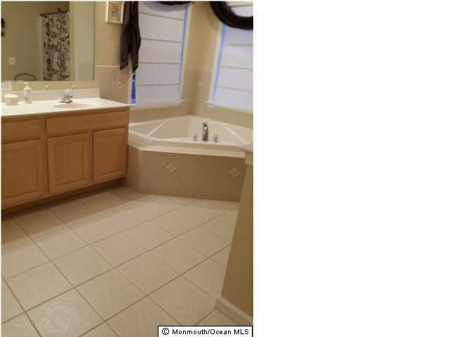 159 Brigantine Road Manahawkin, NJ 08050 - Photo 14 of 23 a bathroom with a sink and a bathtub