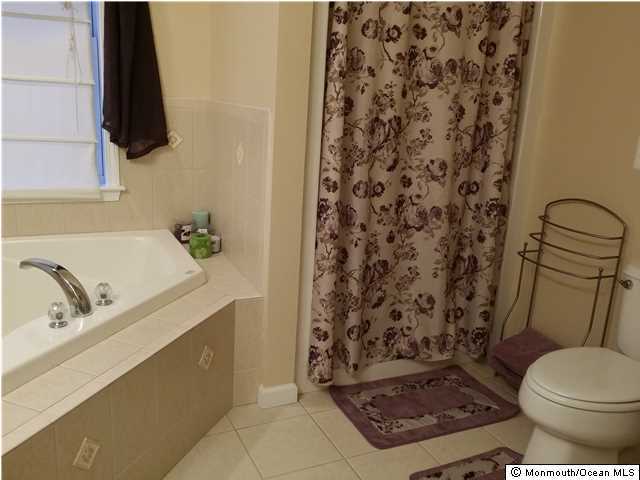 159 Brigantine Road Manahawkin, NJ 08050 - Photo 15 of 23 a bathroom with a sink toilet and shower