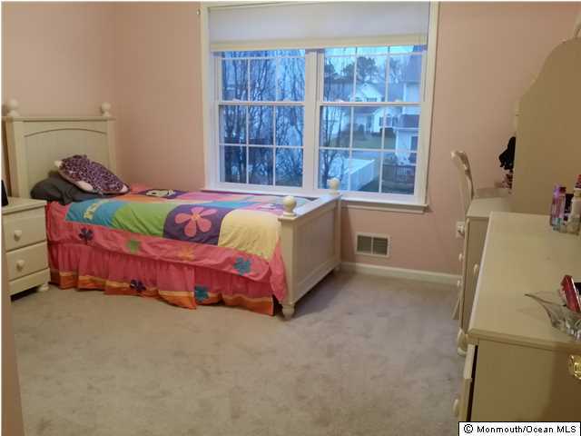 159 Brigantine Road Manahawkin, NJ 08050 - Photo 18 of 23 a bedroom with a bed and window