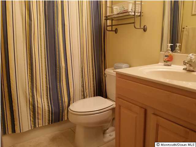 159 Brigantine Road Manahawkin, NJ 08050 - Photo 20 of 23 a bathroom with a sink a toilet and shower