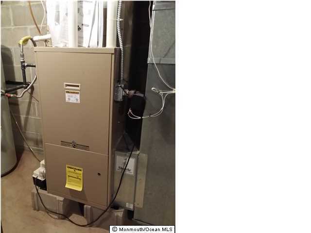 159 Brigantine Road Manahawkin, NJ 08050 - Photo 22 of 23 a room with water heater and utility