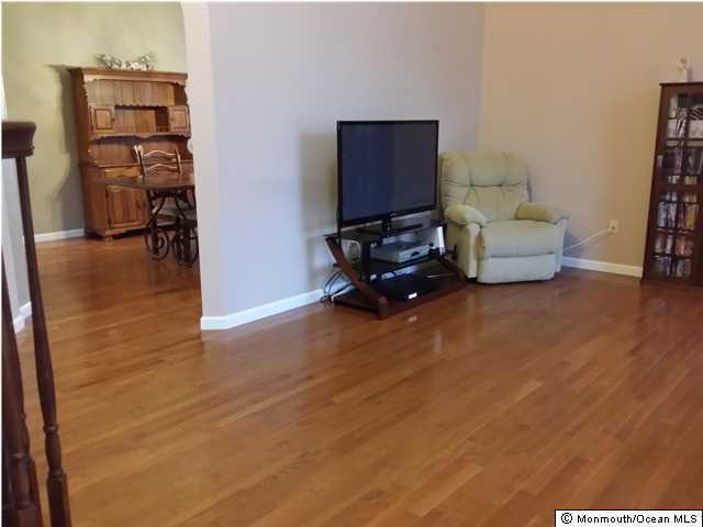 159 Brigantine Road Manahawkin, NJ 08050 - Photo 3 of 23 a living room with furniture and a flat screen tv