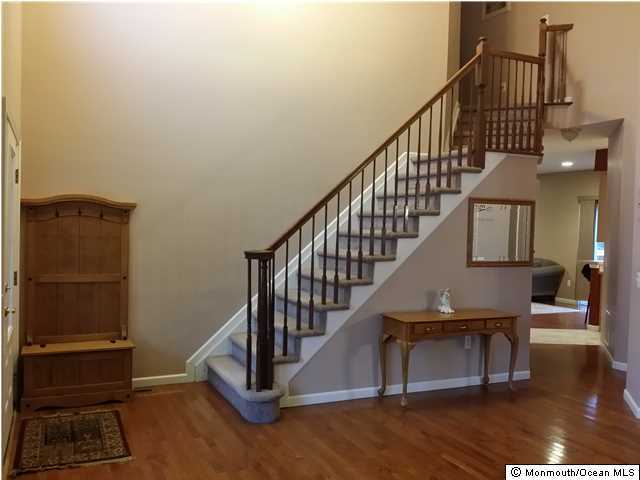 159 Brigantine Road Manahawkin, NJ 08050 - Photo 4 of 23 a view of entryway with wooden floor