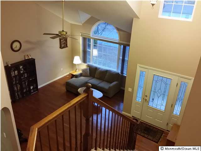159 Brigantine Road Manahawkin, NJ 08050 - Photo 5 of 23 a view of entryway and hall with wooden floor