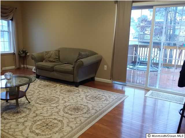 159 Brigantine Road Manahawkin, NJ 08050 - Photo 8 of 23 a living room with furniture and a rug