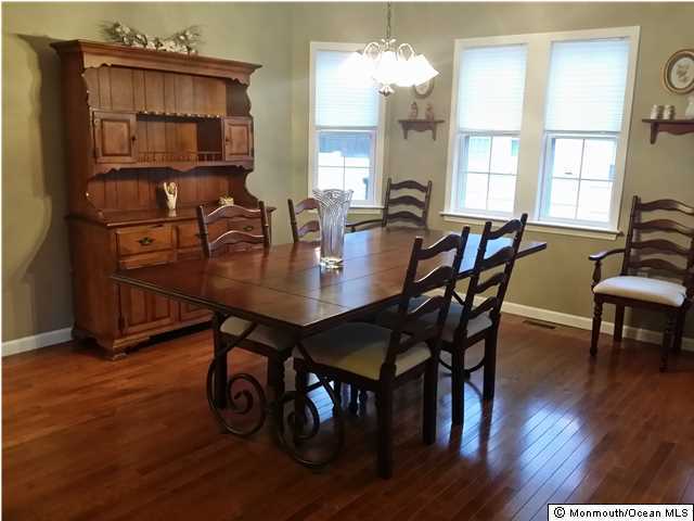 159 Brigantine Road Manahawkin, NJ 08050 - Photo 9 of 23 a view of a dining room with furniture window and wooden floor