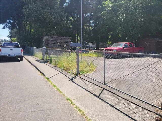 a swimming pool with outdoor seating and yard
