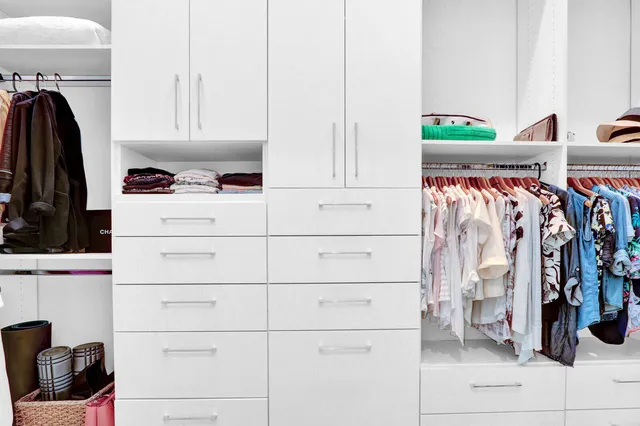 a bathroom with a granite countertop sink mirror and double