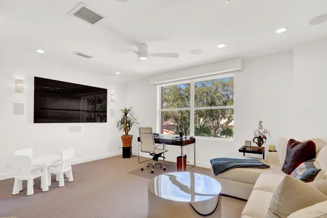 a view of a patio with a table chairs and a garden